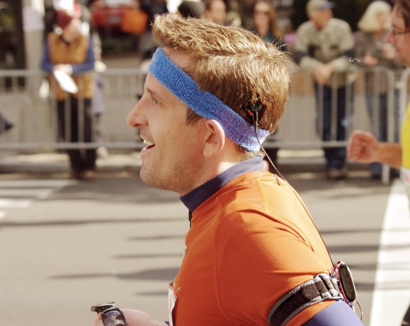 Man with CI listening to music while running