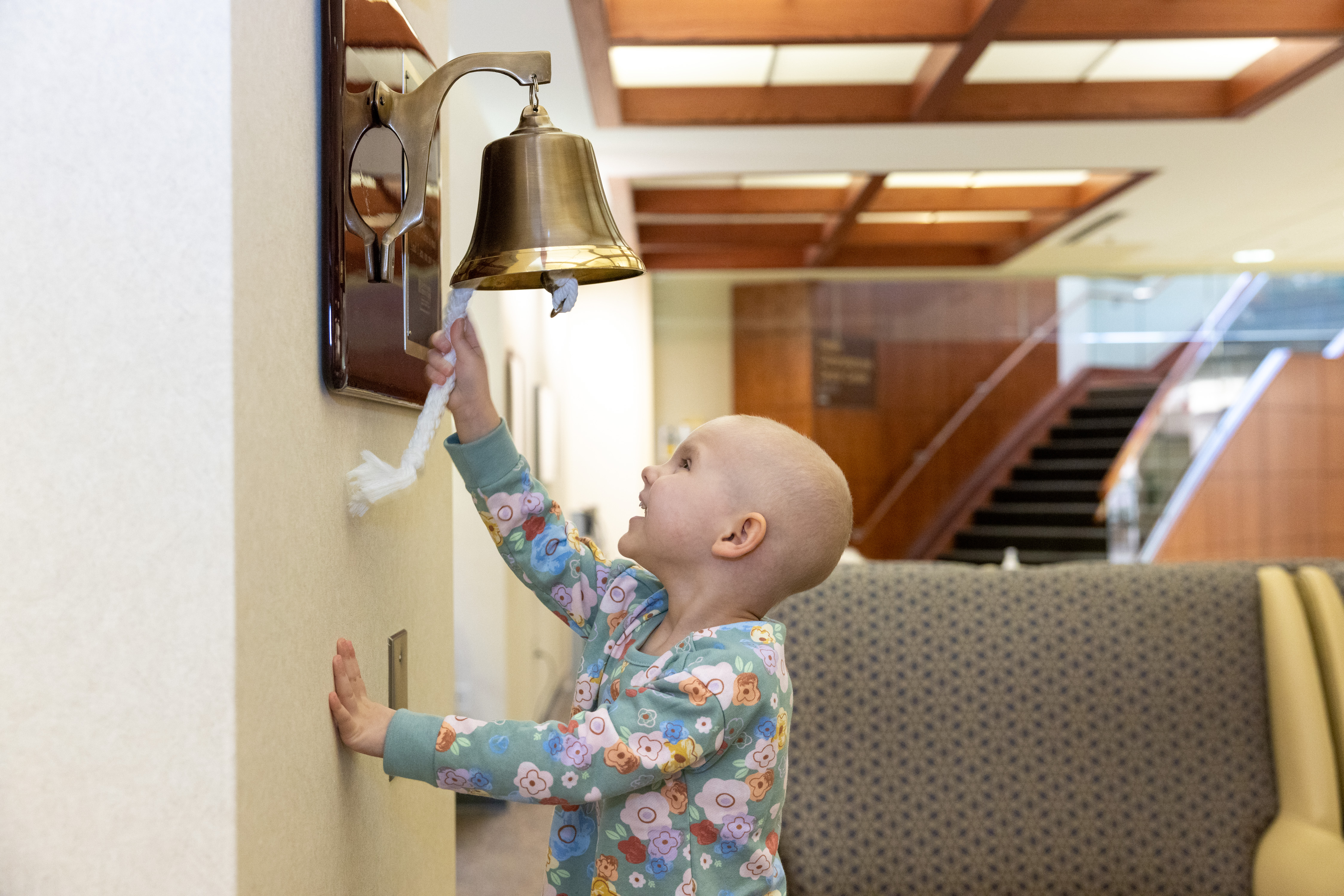 Pediatric patient rings bell after final cancer treatment.