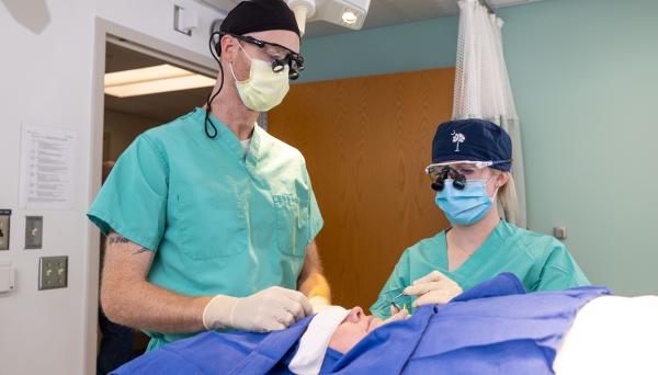 Kirk Sidey MD, MBA, and Chandler Jansen, MD, Micrographic Surgery and Dermatologic Oncology Fellow, with a simulated patient in the dermatology clinic on the UI Health Care university campusk on Tuesday, Oct. 1, 2024.