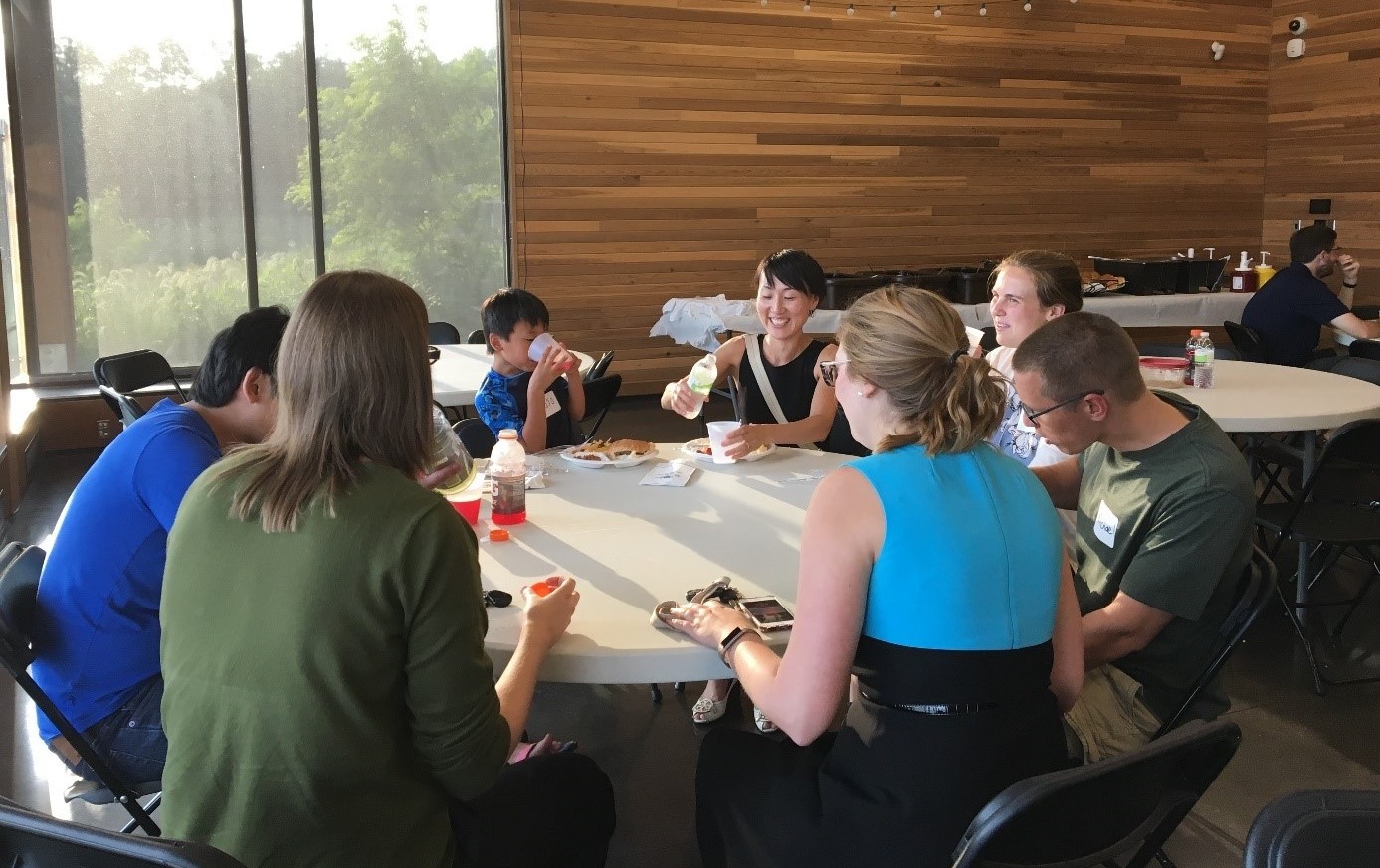 A group of residents enjoy a meal together